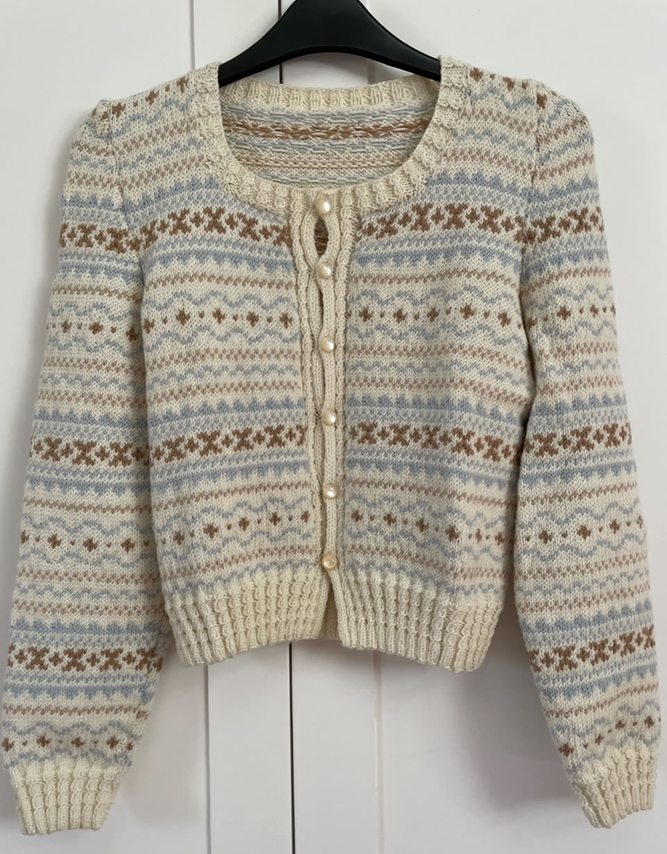 hand knitted cardigan designed by Erica James